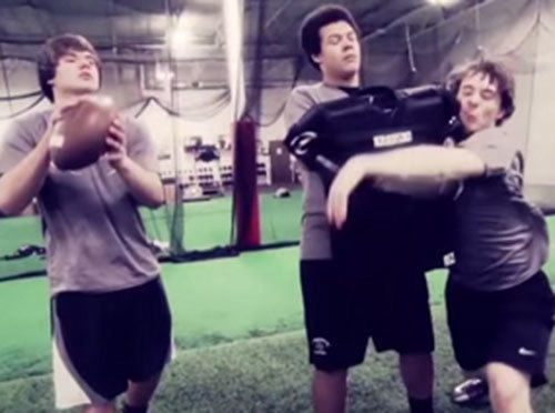 Football players participating in linebacker coverage drill